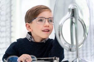 little-boy-store-trying-glasses_23-2148920028